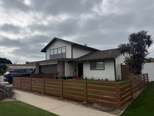 Stepped Fence Installation for a Modern Front Yard